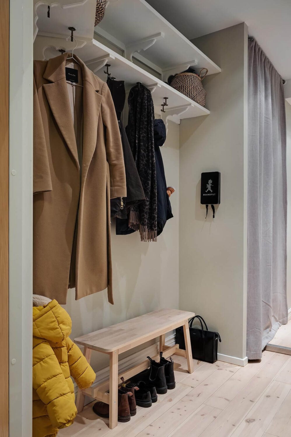 A Swedish Apartment with an Open Living Space and Period Features 30 hallway with shelves and coat hangers A Swedish Apartment with an Open Living Space and Period Features
