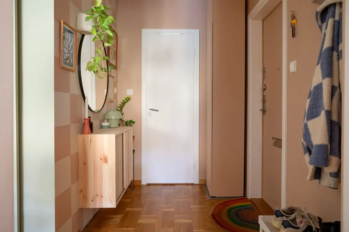 A Swedish Apartment with a Dutch Parquet Floor and Terracotta Bedroom 18 hallway with wooden storage cabinet
