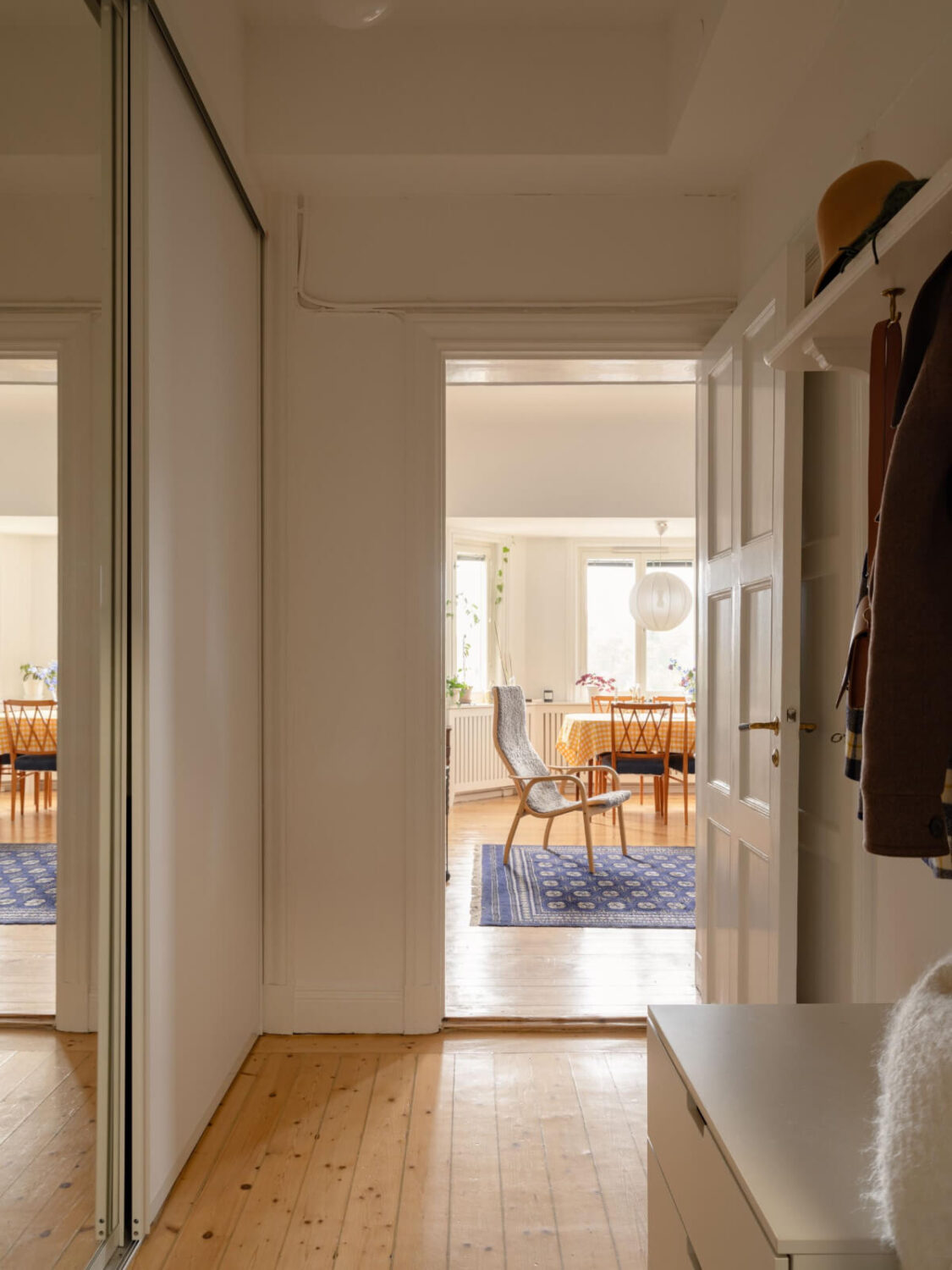 A Small Apartment with High Ceilings and a Large Bay Window 21 hallway wooden floor