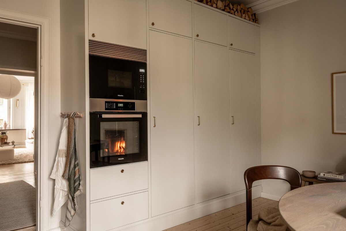 A Beautiful Calm 1920s Apartment in Gothenburg 17 high kitchen cabinets