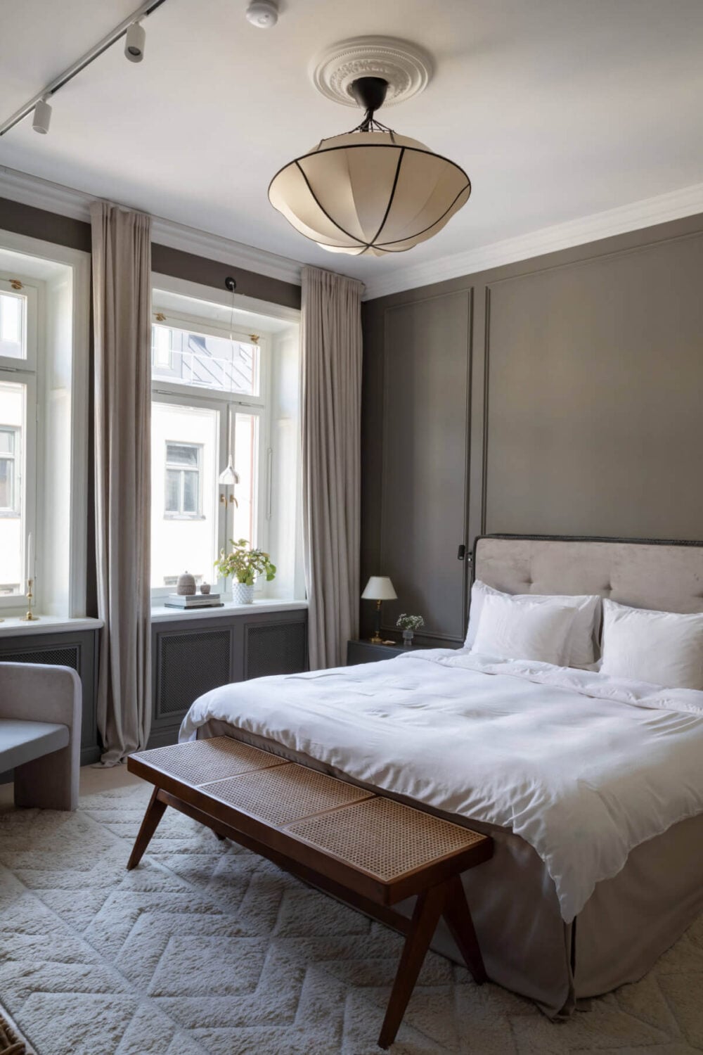 A Calm, Neutral Color Palette in a Classic Swedish Apartment 17 hotel style bedroom large rug