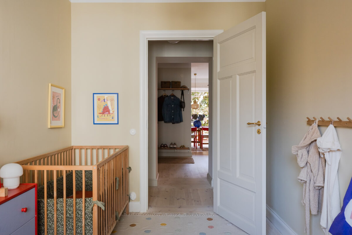 Modern Interiors in a Bright 1930s Apartment in Sweden 31 kids bedroom beige walls wooden cot