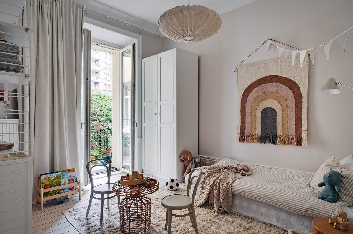 Period Features and Modern Materials in a Swedish Apartment 23 kids bedroom with balcony