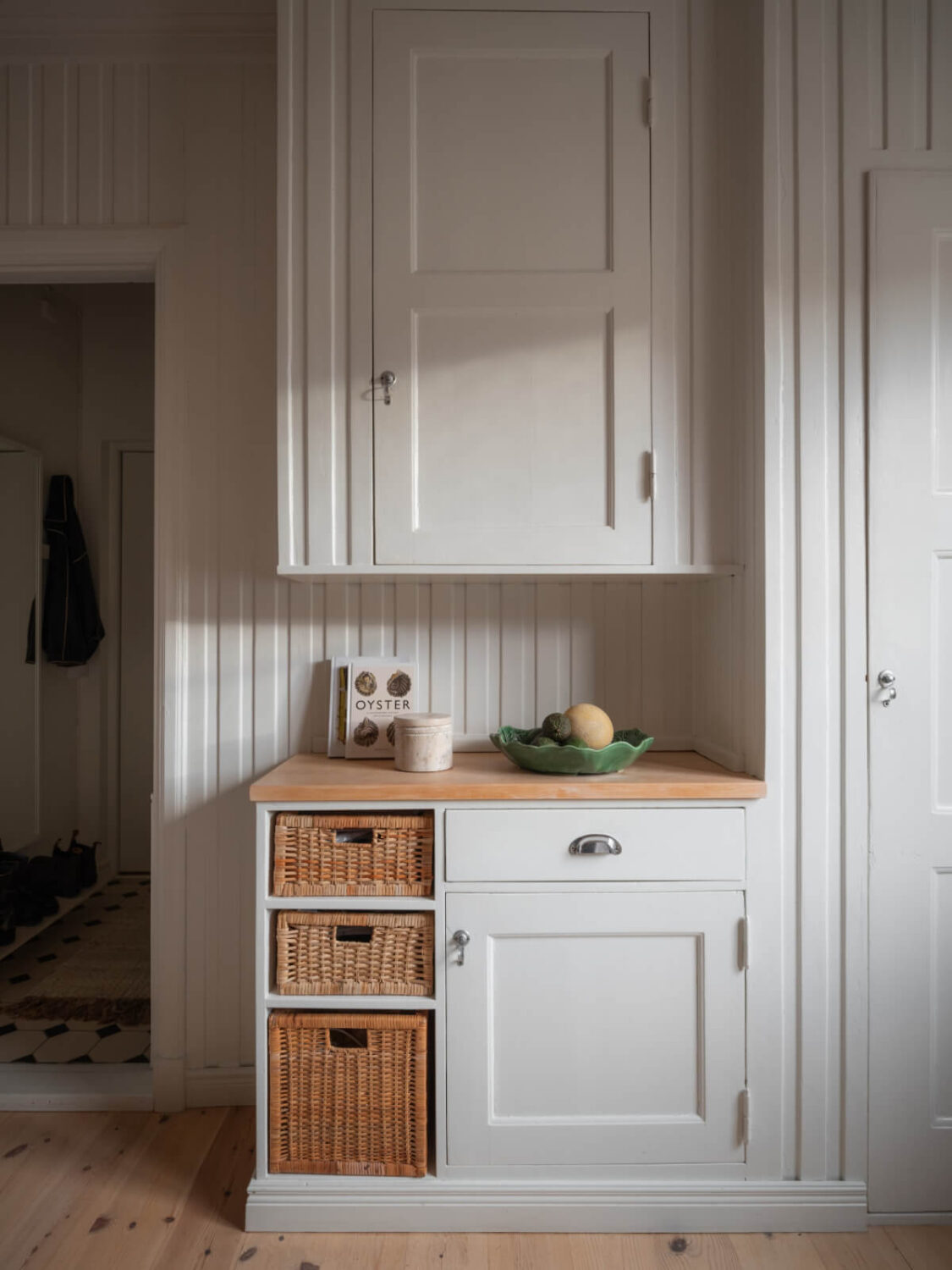 A Renovated Duplex Apartment with Exposed Brick Walls 11 kitchen cabinets
