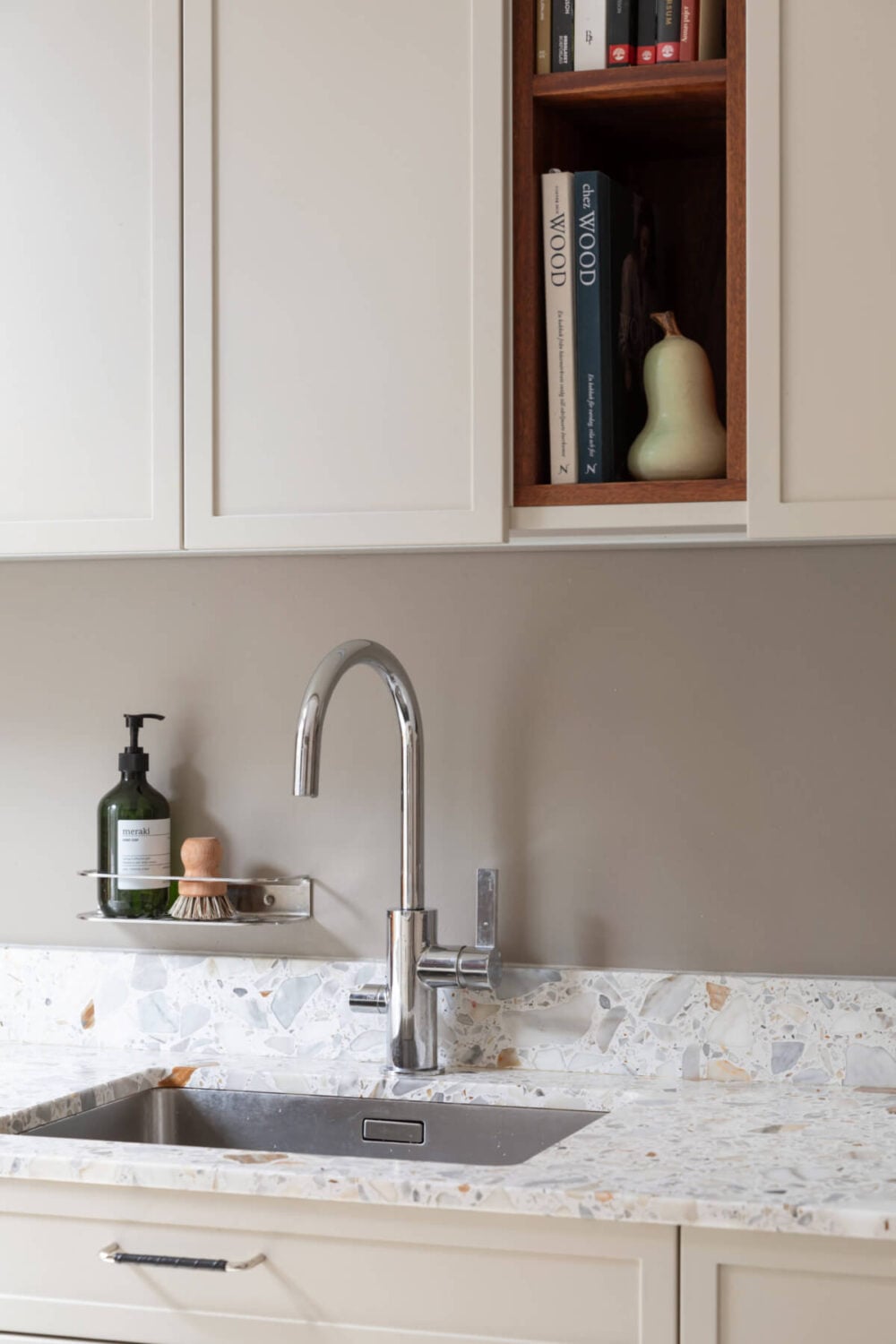 A Calm, Neutral Color Palette in a Classic Swedish Apartment 10 kitchen detail terrazzo worktop open cabinet nordroom