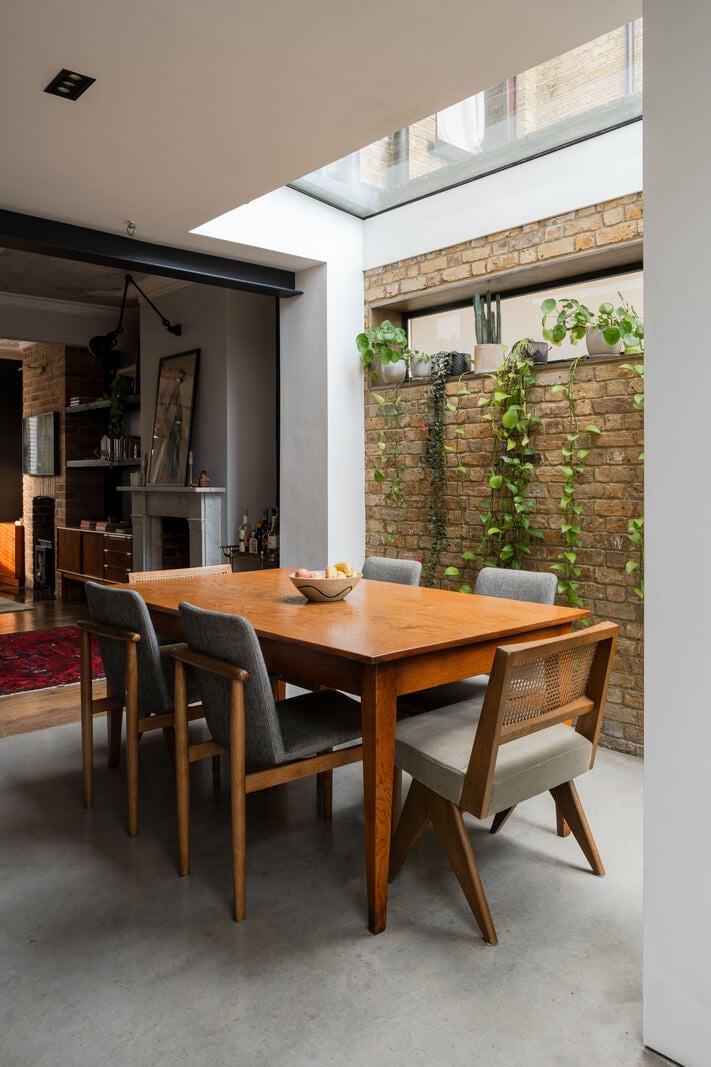 A Restored Victorian House with Exposed Brick and a Kitchen Extension 5 kitchen dining table brick wall skylight