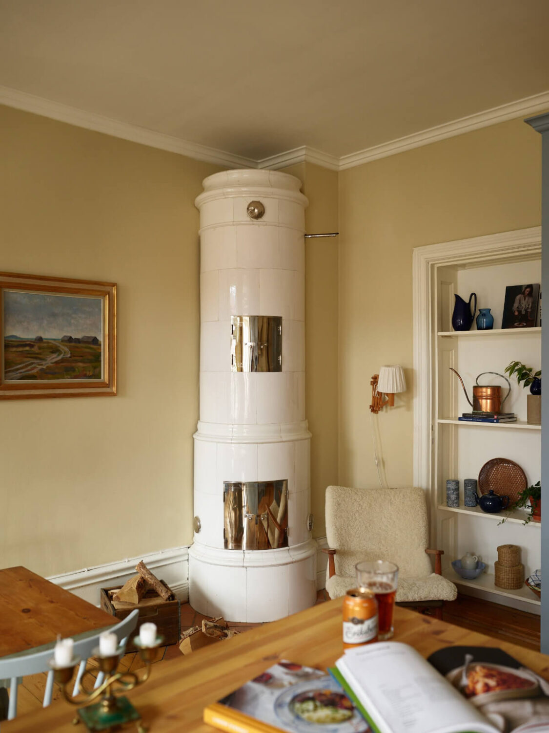 A Charming Historic Stockholm Apartment with a Blue Kitchen 12 kitchen fireplace and built in shelves