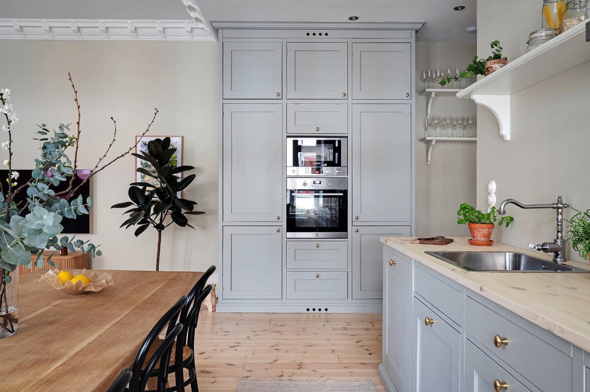A Swedish Apartment with an Open Living Space and Period Features 15 kitchen floor to ceiling cabinet