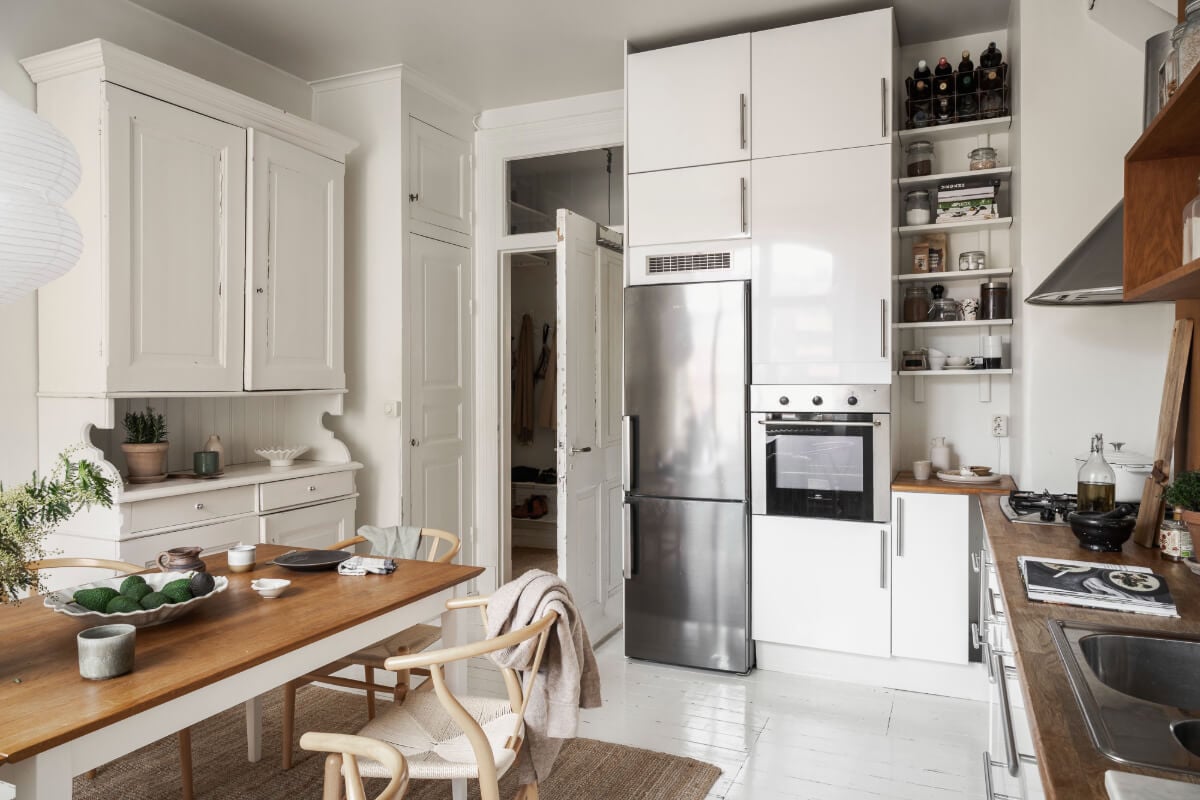 A Stylish Studio Apartment with Period Features and Large Windows 21 kitchen floor to ceiling cabinets