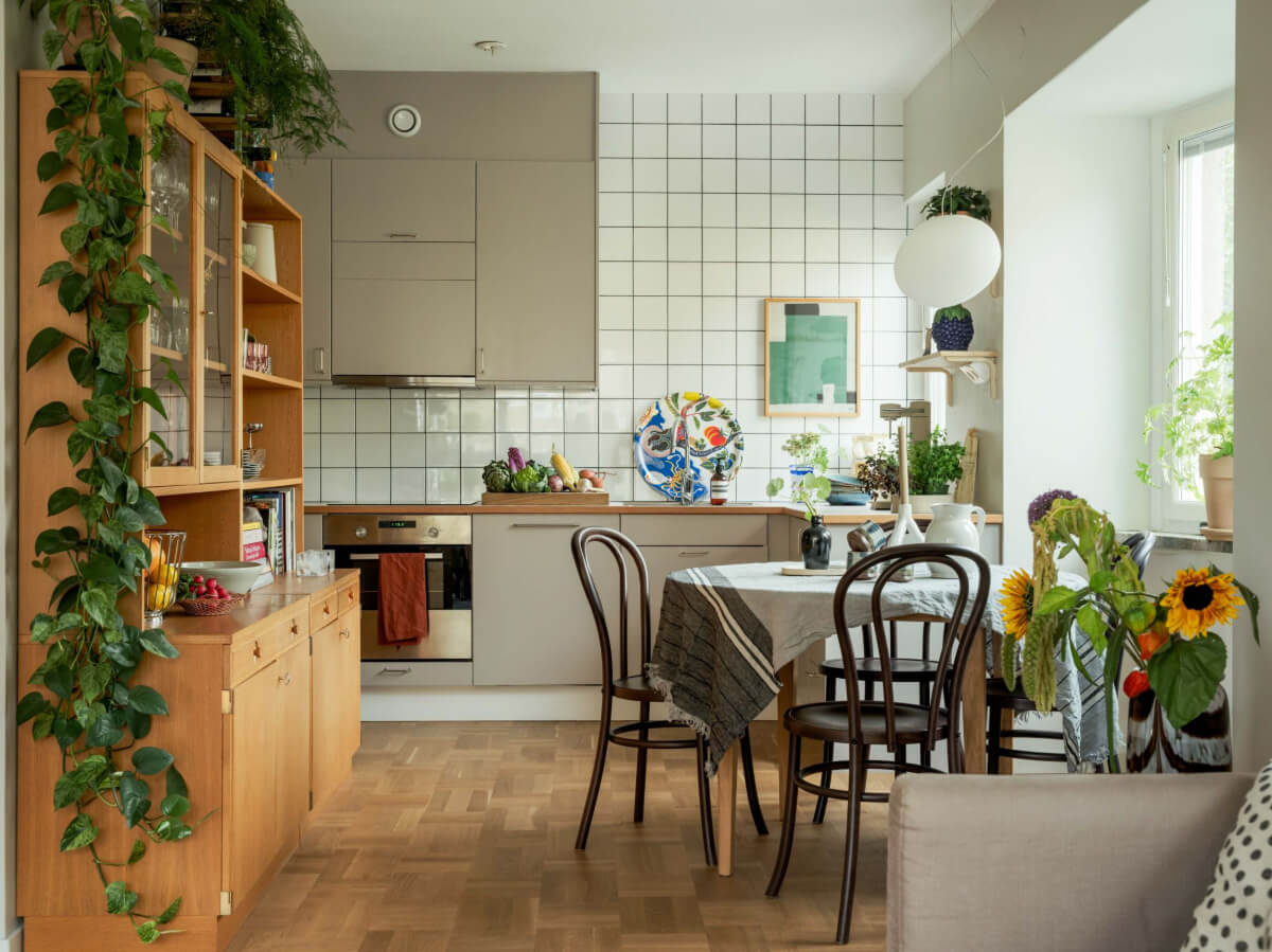 A Swedish 1940s Apartment with Lovely Balcony Views 1 kitchen gray cabinets round table