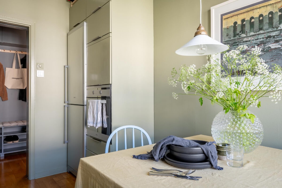Light Rooms and a Moody Color Palette in a 1930s Apartment 20 kitchen green walls cabinets