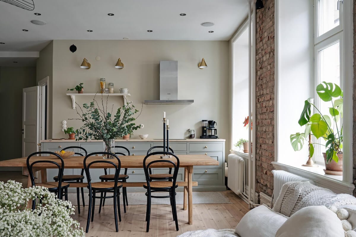 A Swedish Apartment with an Open Living Space and Period Features 9 kitchen large wooden table