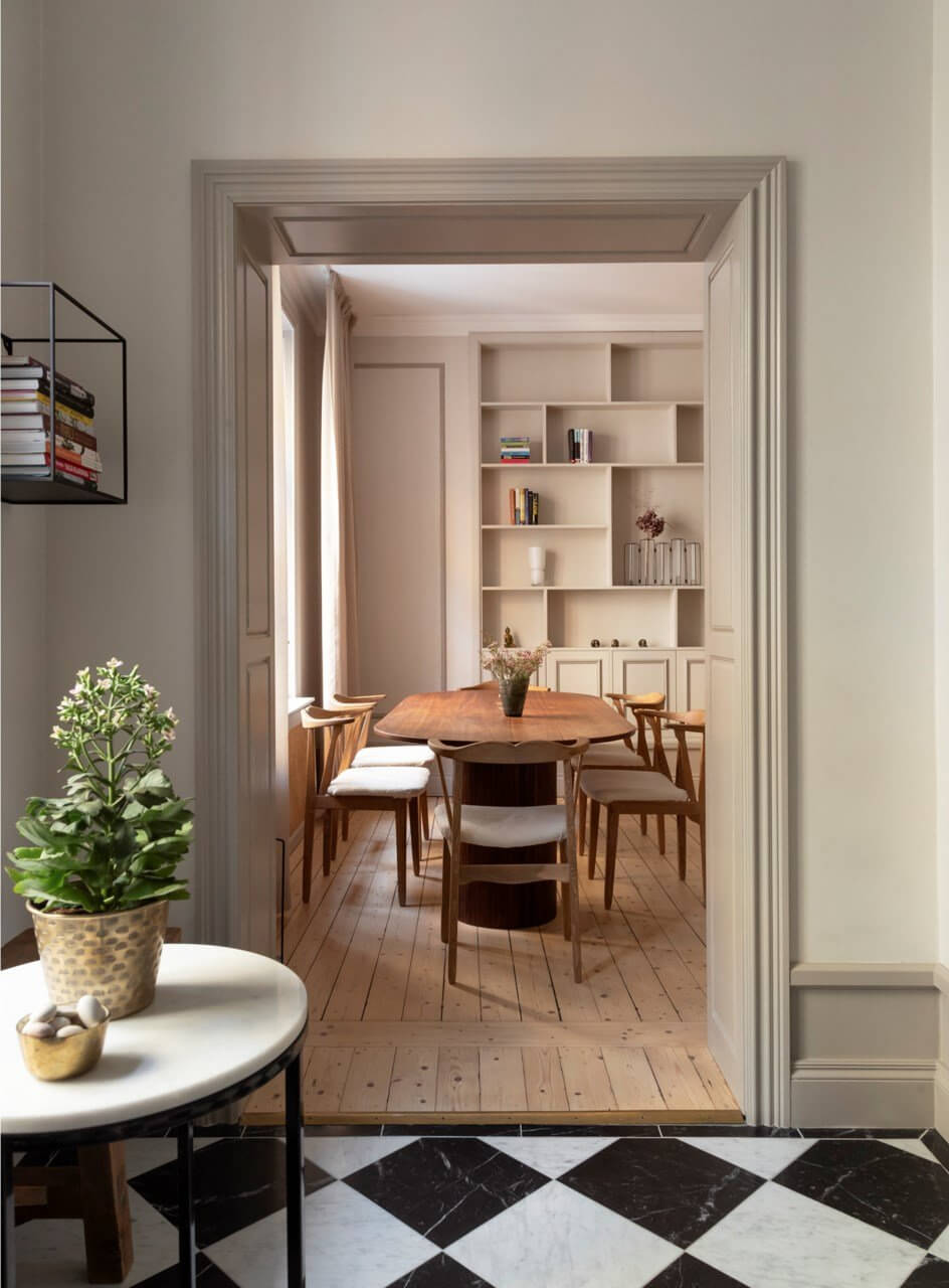 A Stylish Two-Bedroom Apartment in Stockholm 8 kitchen marble checkerboard tile view into living room