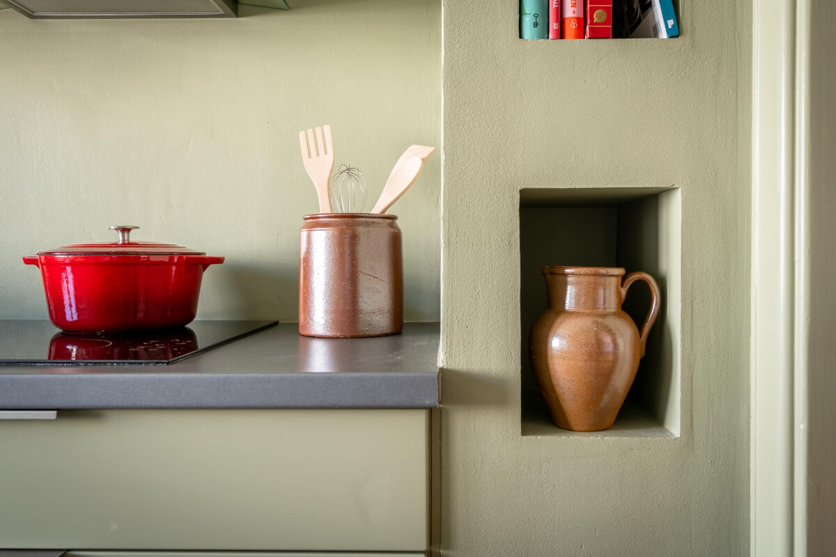 Light Rooms and a Moody Color Palette in a 1930s Apartment 19 kitchen niches