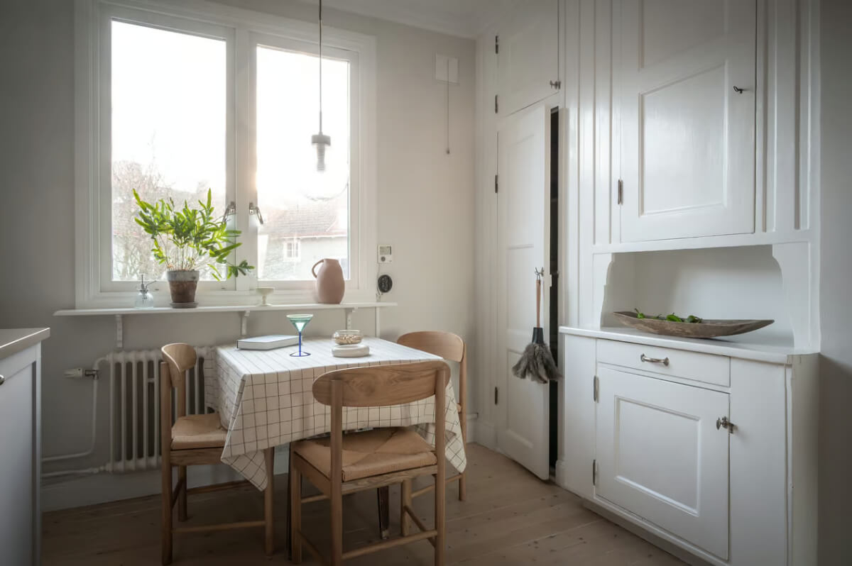 A Duplex Apartment with Period Features and a Charming Attic Bedroom 8 kitchen original cabinets and dining table