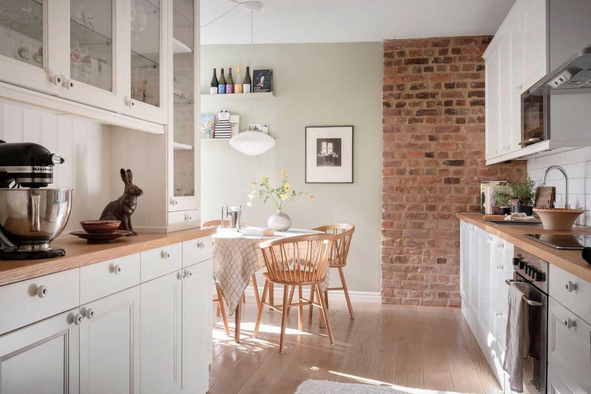Bright Rooms with Light Color Tones in a Swedish Apartment 12 kitchen round table brick wall