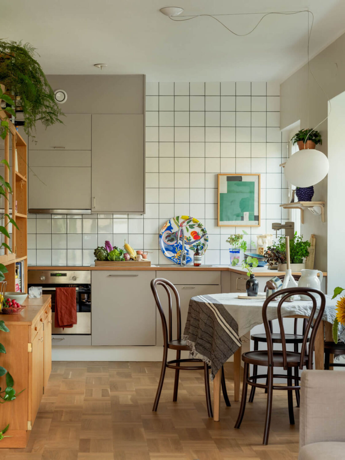 A Swedish 1940s Apartment with Lovely Balcony Views 11 kitchen white backsplash tiles to ceiling