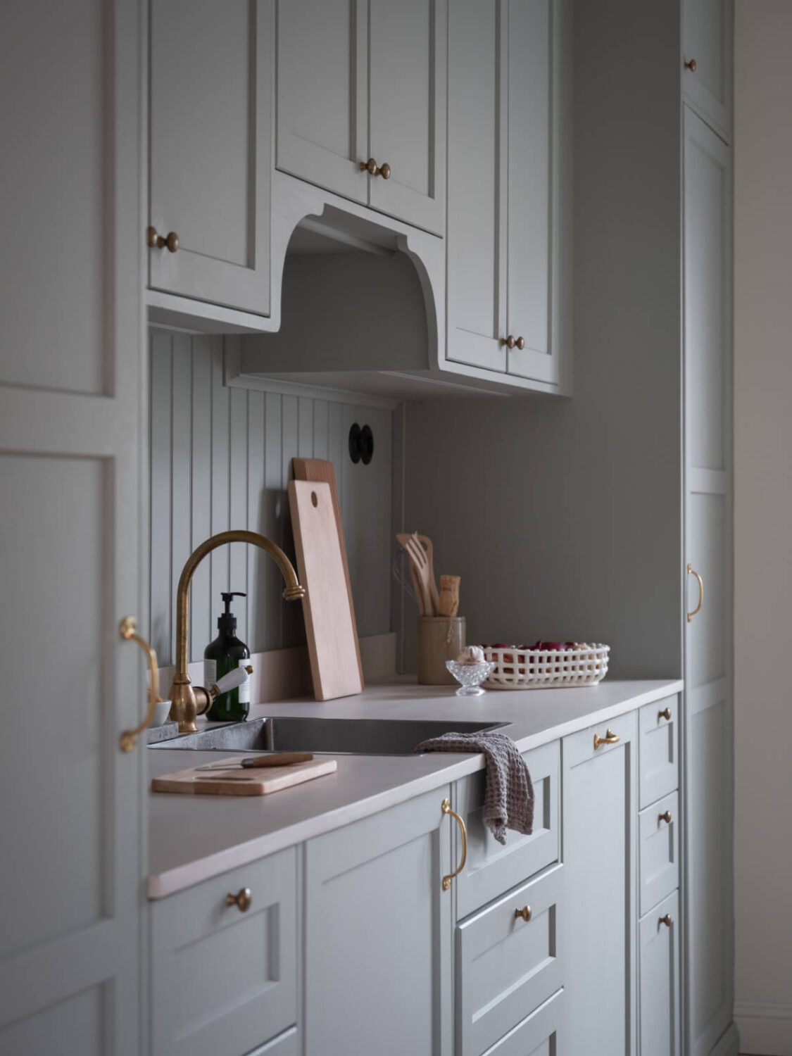A Carefully Renovated Family Home in Sweden 9 kitchen with brass fittings