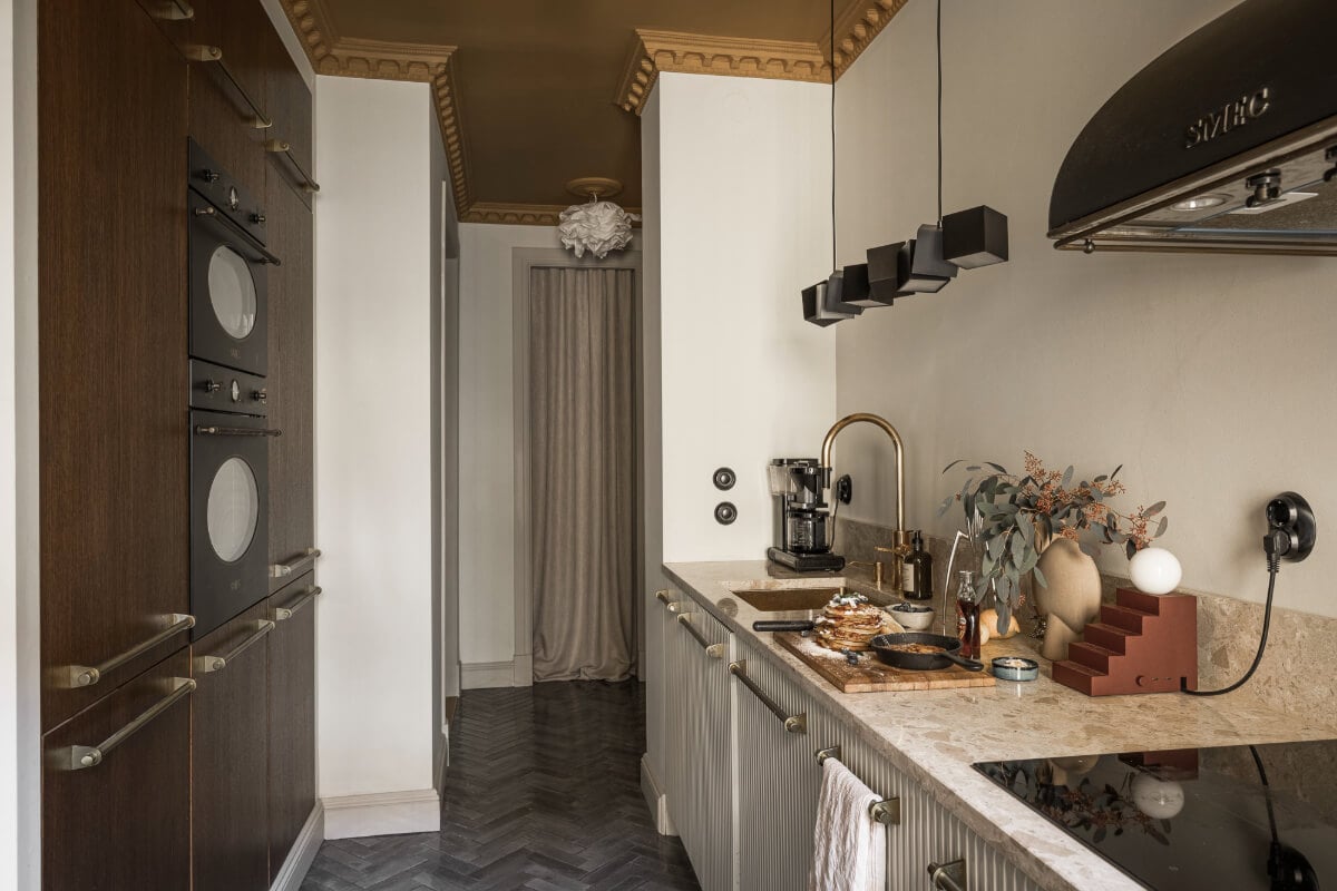 A Swedish Apartment with Exclusive Materials and Monochrome Color Scheme 9 kitchen with floor to ceiling cabinets painted ceiling