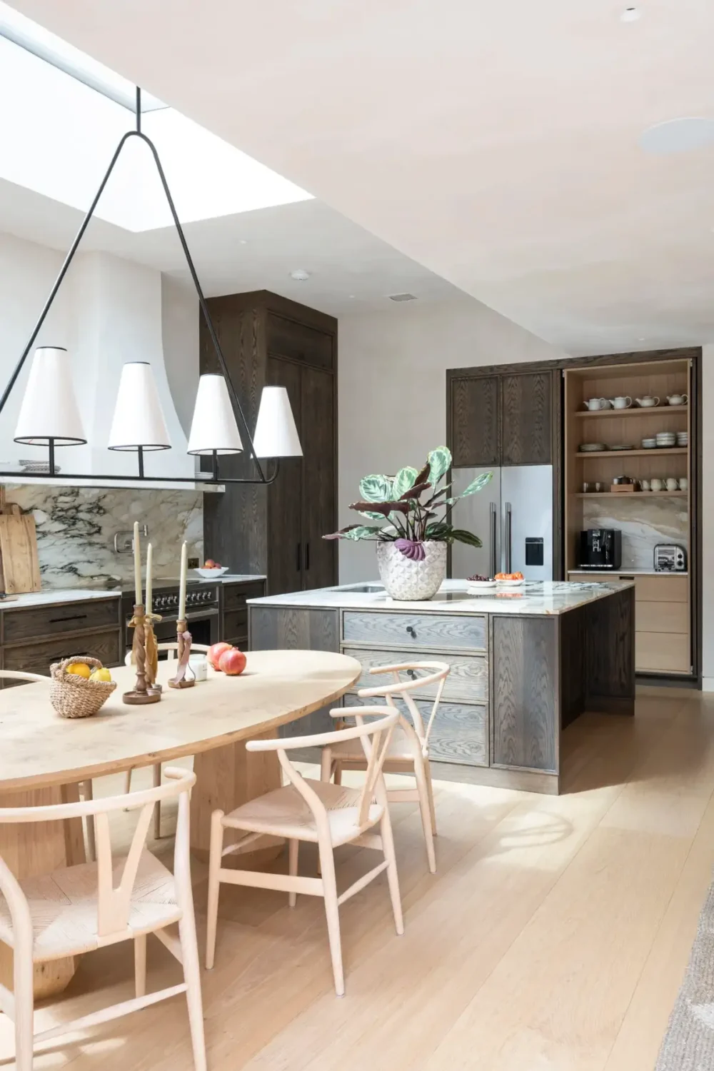 A Timeless Energy-Efficient Victorian Townhouse in Bedford Park 4 kitchen with large island and dining table
