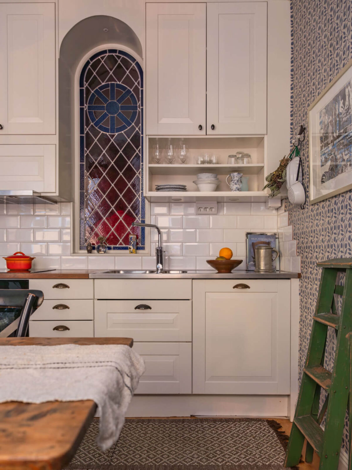 A Charming Home in a 17-Century Apartment in Stockholm's Old Town 14 kitchen with unique arched window