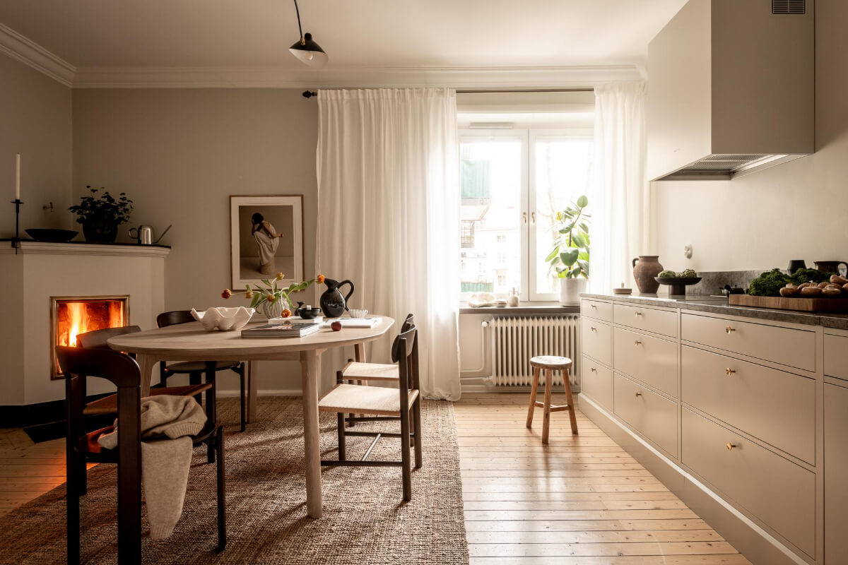 A Beautiful Calm 1920s Apartment in Gothenburg 15 kitchen wooden floor large table fireplace