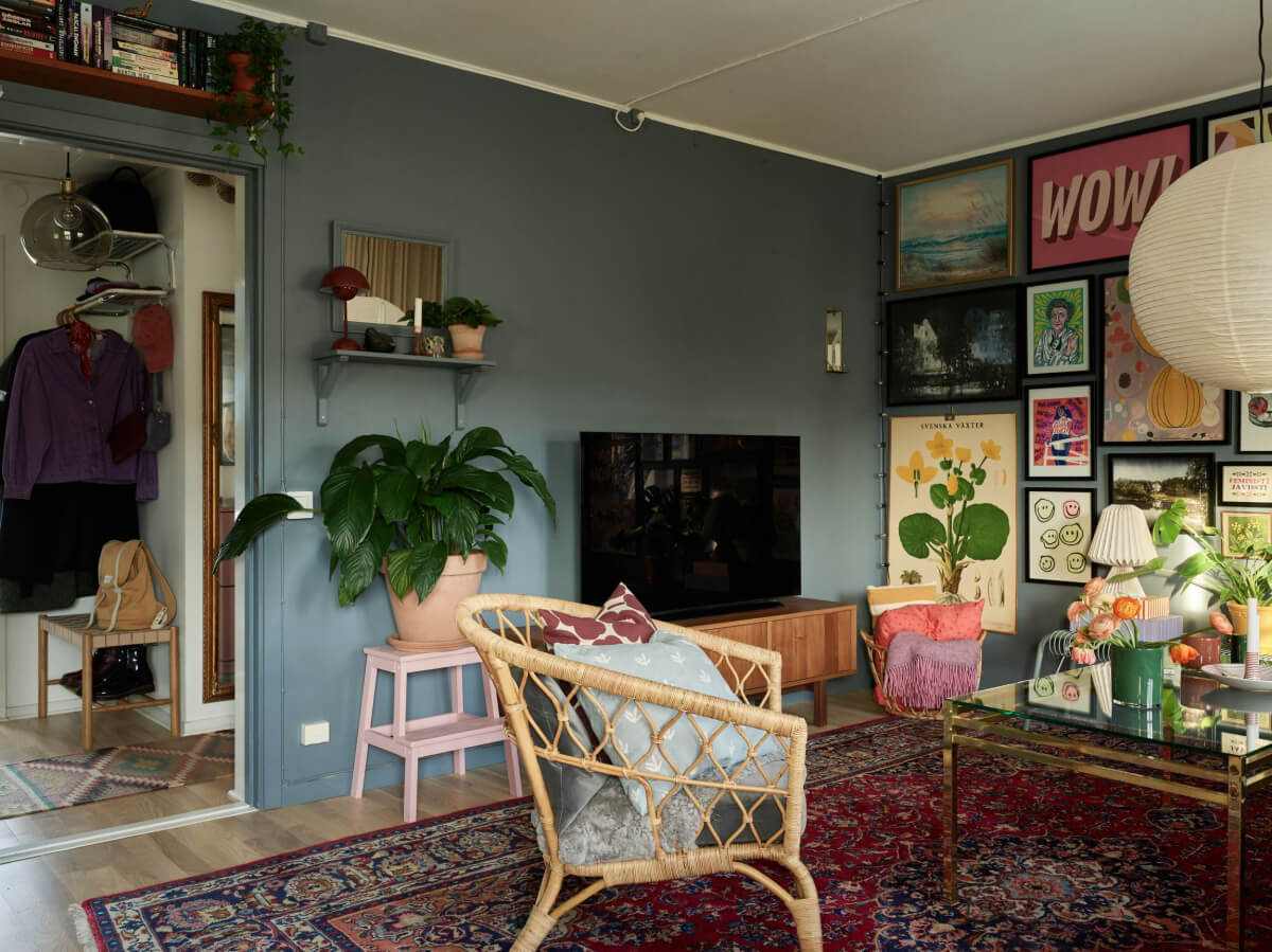 A Colorful Midcentury Apartment Filled with Art and Plants 9 large persian rug living room