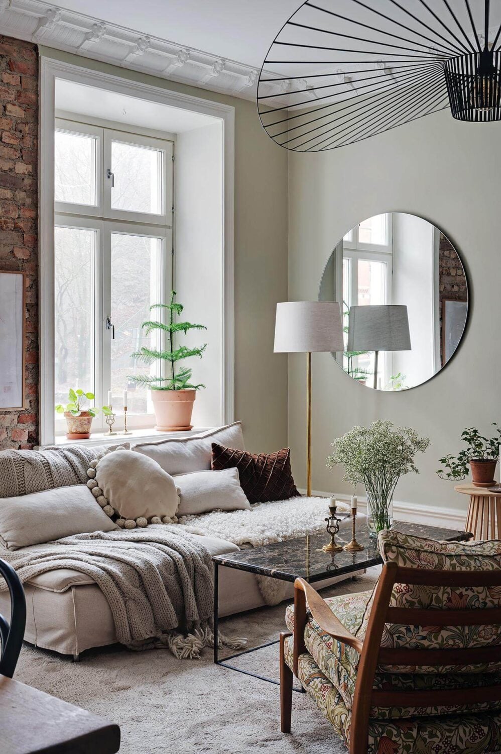 A Swedish Apartment with an Open Living Space and Period Features 3 layered textiles sitting room