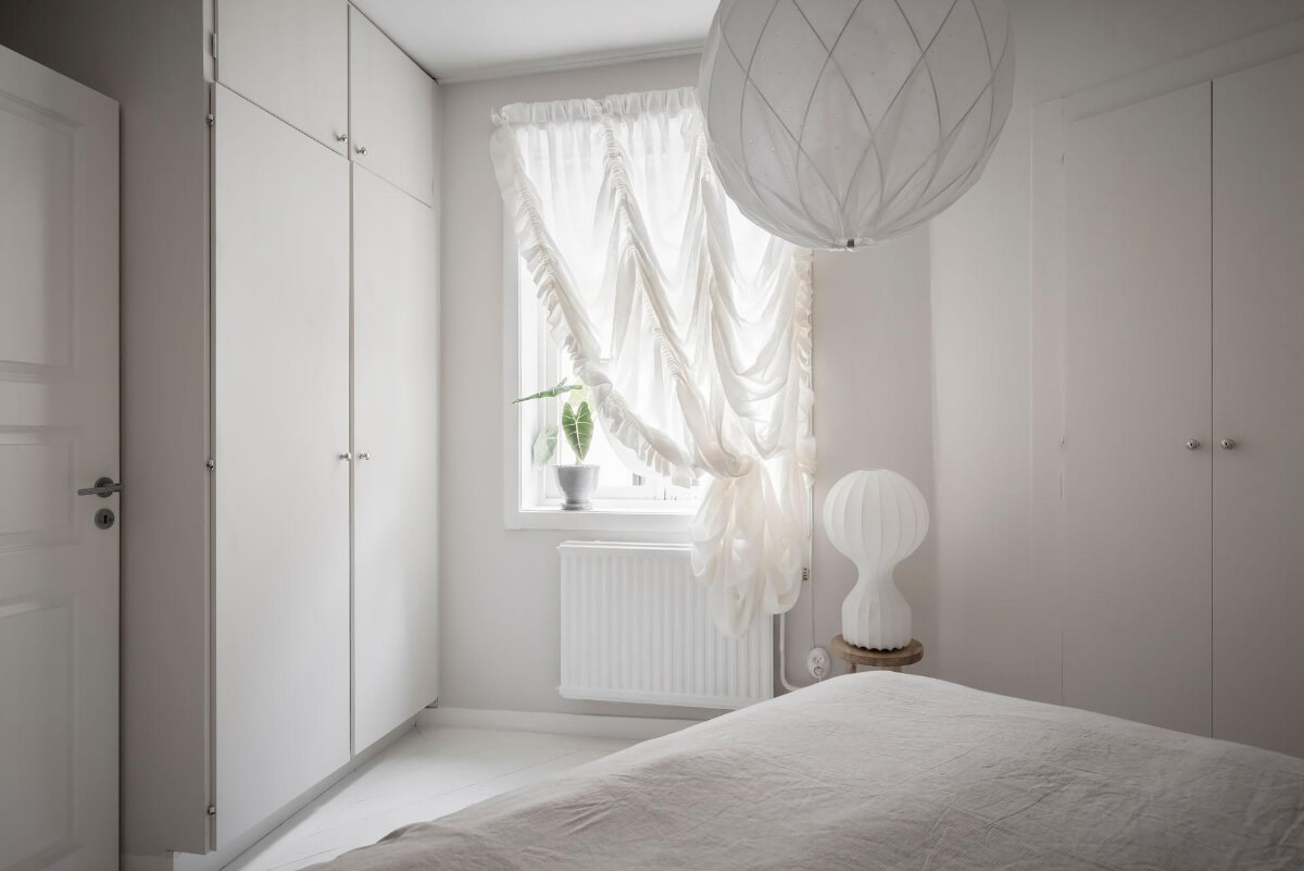 White-Painted Floorboards in a Turn-of-the-Century Apartment 21 light bedroom built-in wardrobes