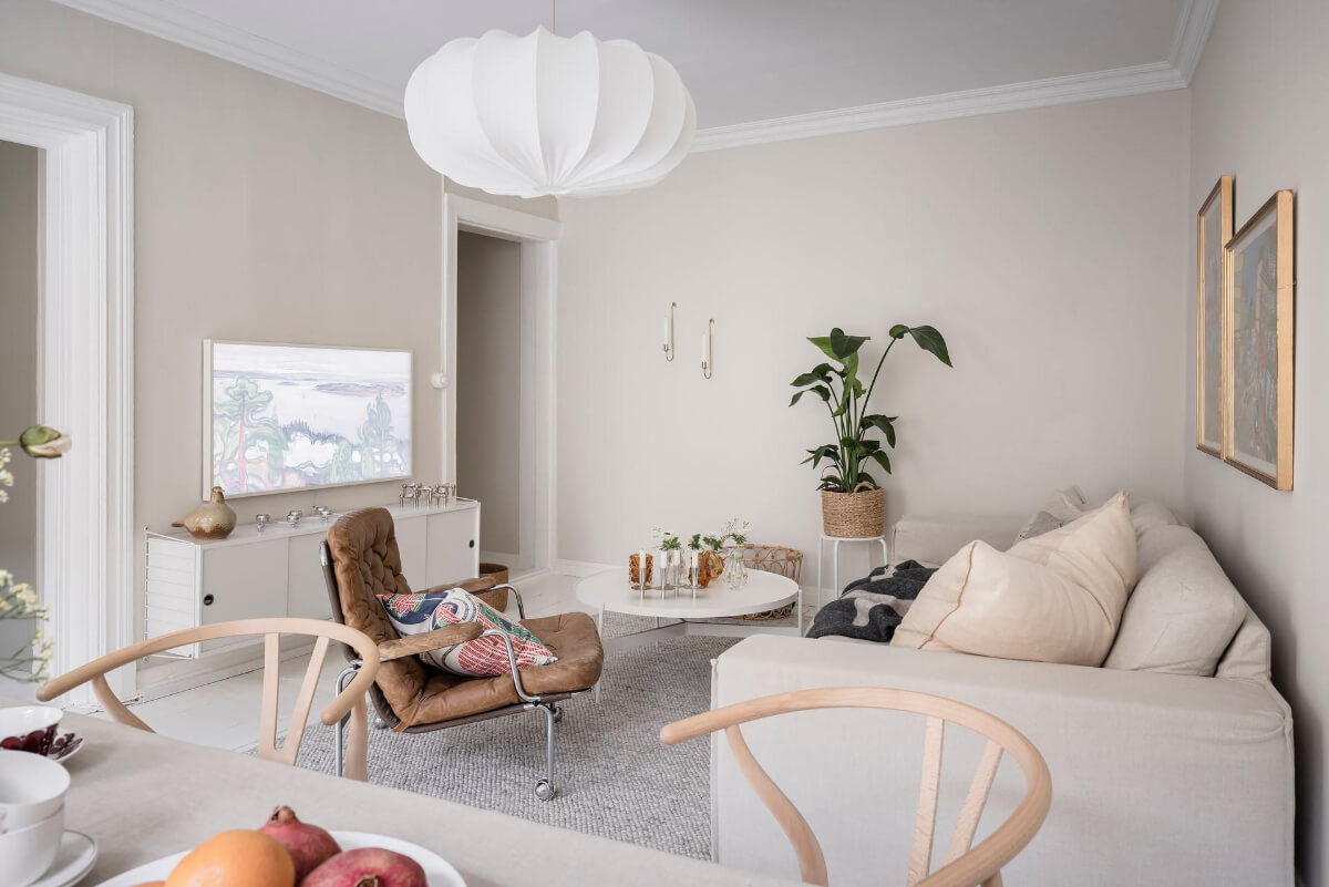 White-Painted Floorboards in a Turn-of-the-Century Apartment 3 light beige living room