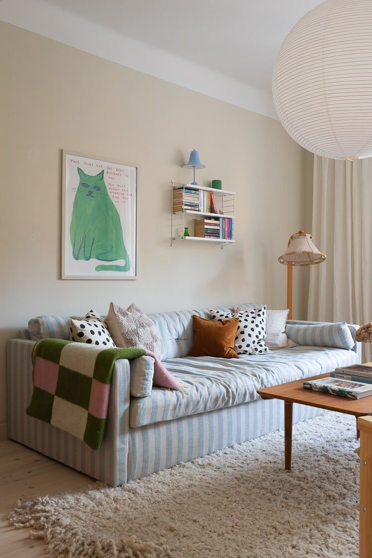 Modern Interiors in a Bright 1930s Apartment in Sweden 18 light blue striped sofa