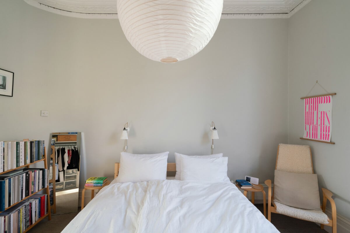 A Light One-Bedroom Apartment in a Victorian Terrace House 14 light gray bedroom bookshelves