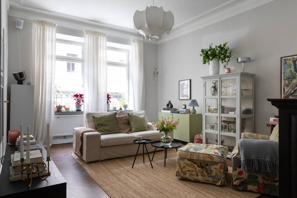 A Charming Ground Floor Apartment with a Large Patio Garden 1 light gray living room floral armchair