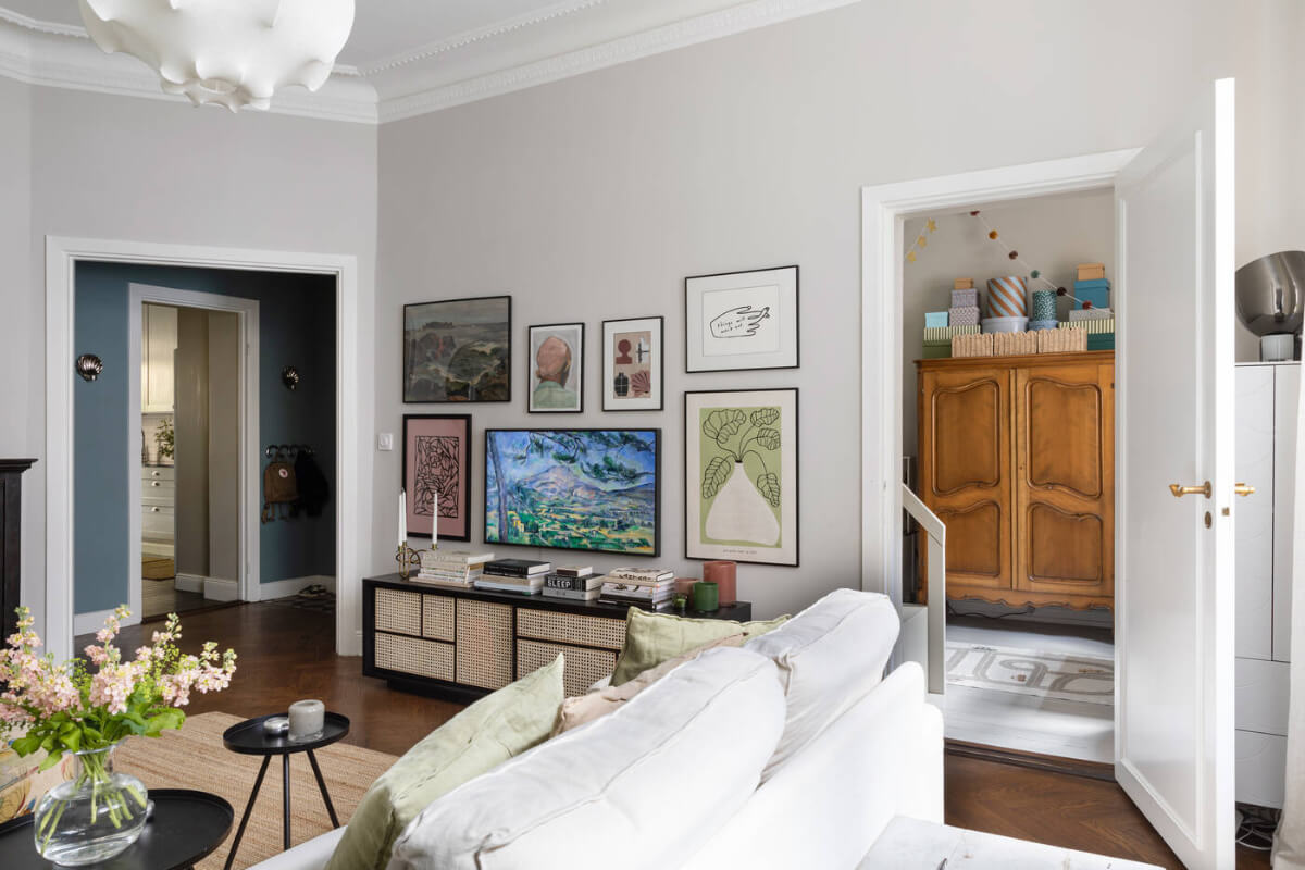 A Charming Ground Floor Apartment with a Large Patio Garden 4 light gray living room gallery wall