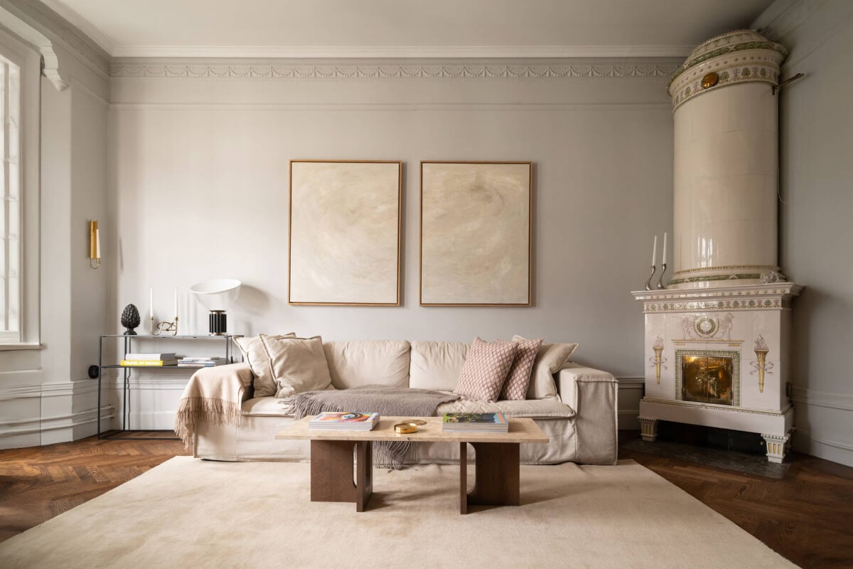 Beautiful Period Features in a One-Bedroom Stockholm Apartment 2 light gray living room large fireplace