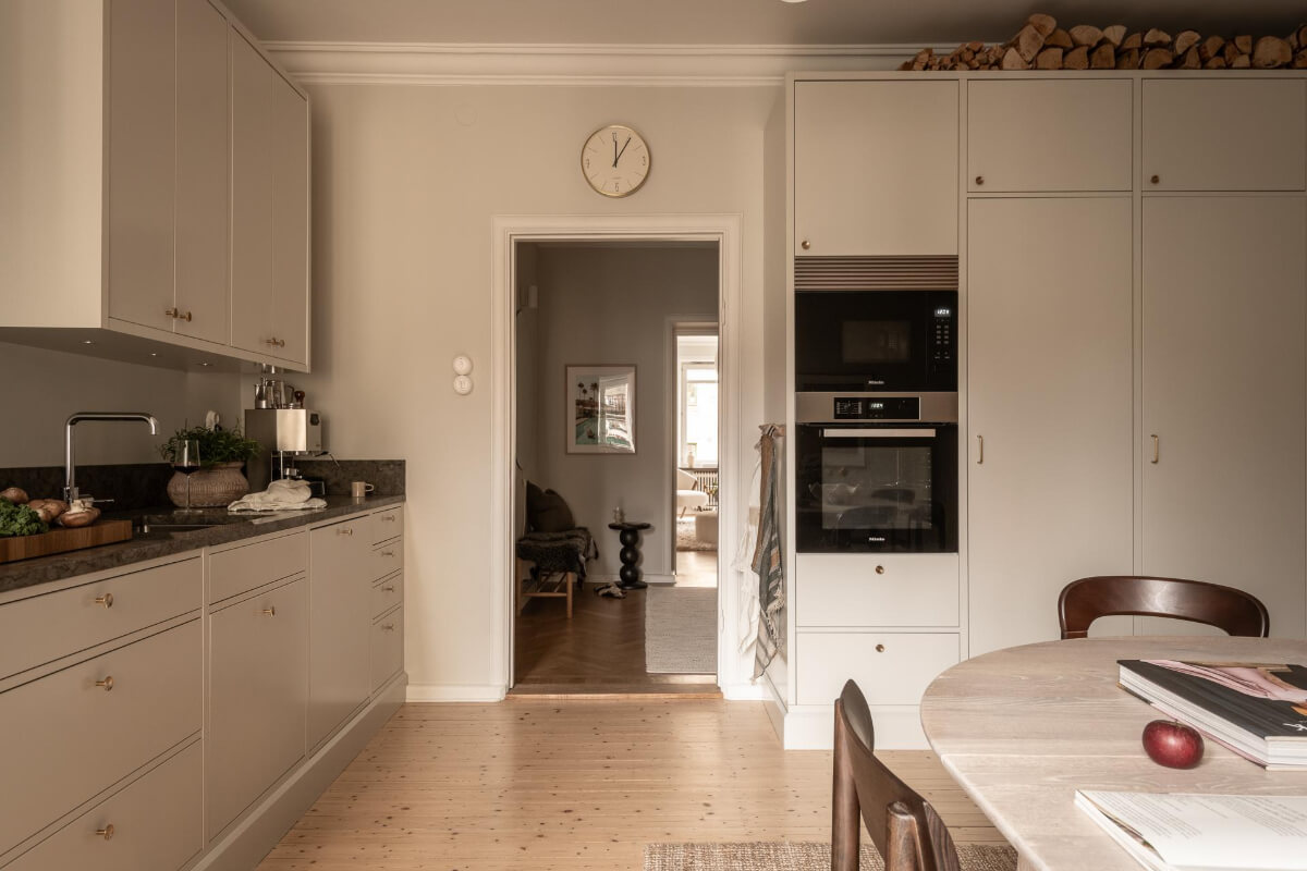 A Beautiful Calm 1920s Apartment in Gothenburg 18 light gray scandi kitchen wooden floor