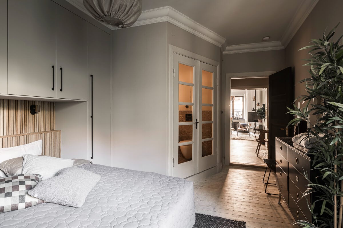 A Swedish Apartment with Exclusive Materials and Monochrome Color Scheme 21 light gray walls bedroom