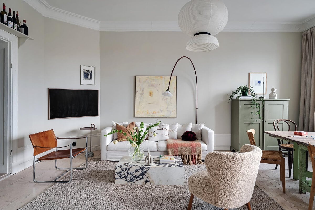 Period Features and Modern Materials in a Swedish Apartment 2 light gray walls living room