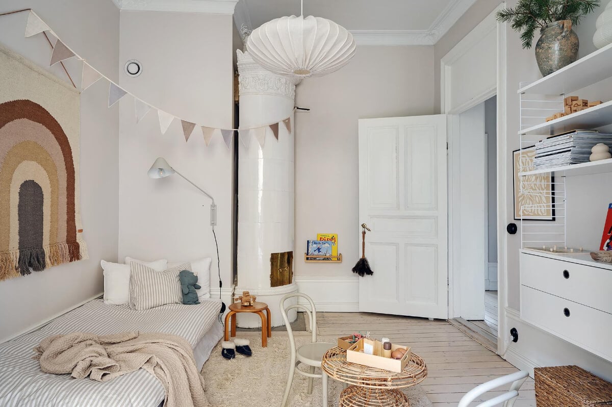 Period Features and Modern Materials in a Swedish Apartment 26 light kids bedroom with fireplace