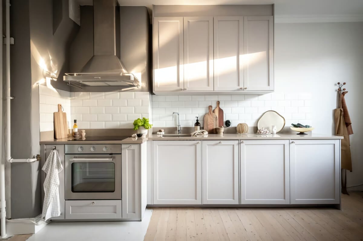 A Duplex Apartment with Period Features and a Charming Attic Bedroom 7 light kitchen white subway tiles