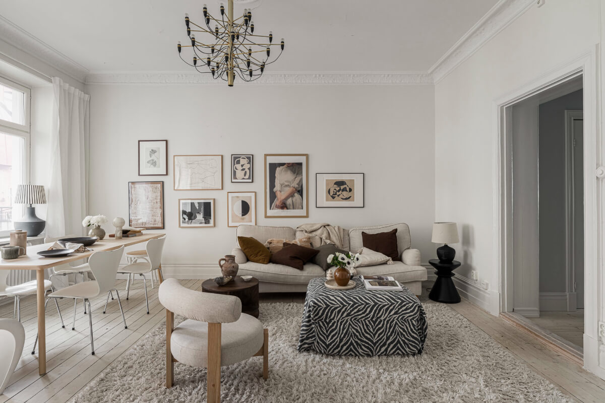 Period Features and Contemporary Solutions in Gothenburg 2 light living room large rug brown textiles