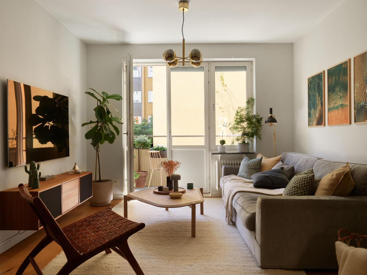 A Stockholm Apartment with a Beautifully Renovated Kitchen 2 light living room large white rug balcony