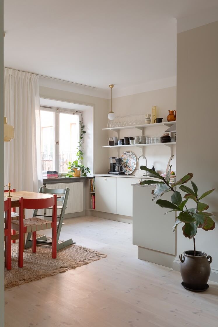 Modern Interiors in a Bright 1930s Apartment in Sweden 2 light scandinavian modern kitchen