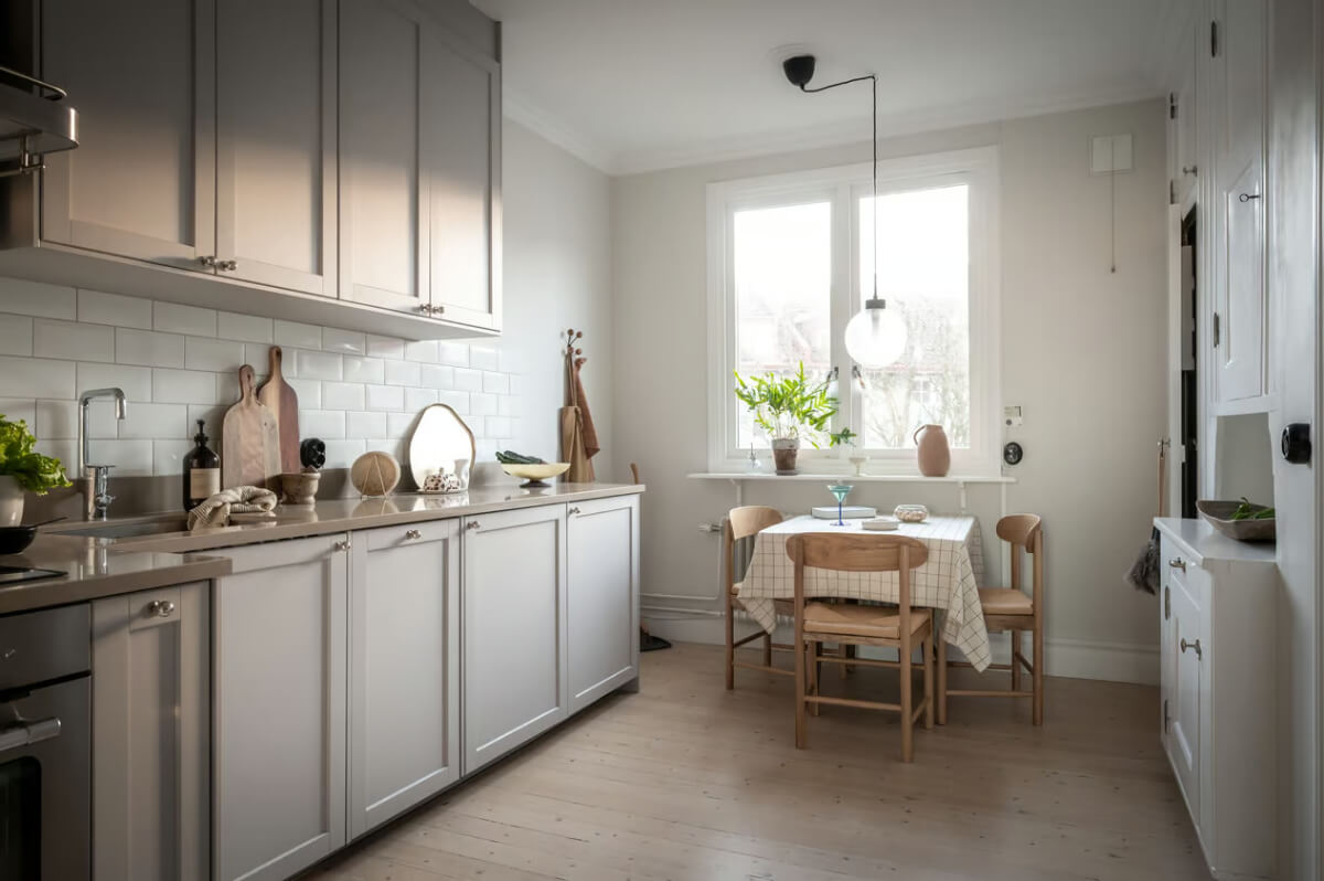 A Duplex Apartment with Period Features and a Charming Attic Bedroom 6 light swedish kitchen with dining table
