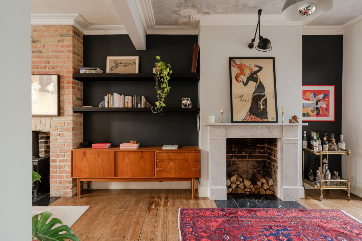 A Restored Victorian House with Exposed Brick and a Kitchen Extension 3 living room black walls marble fireplace