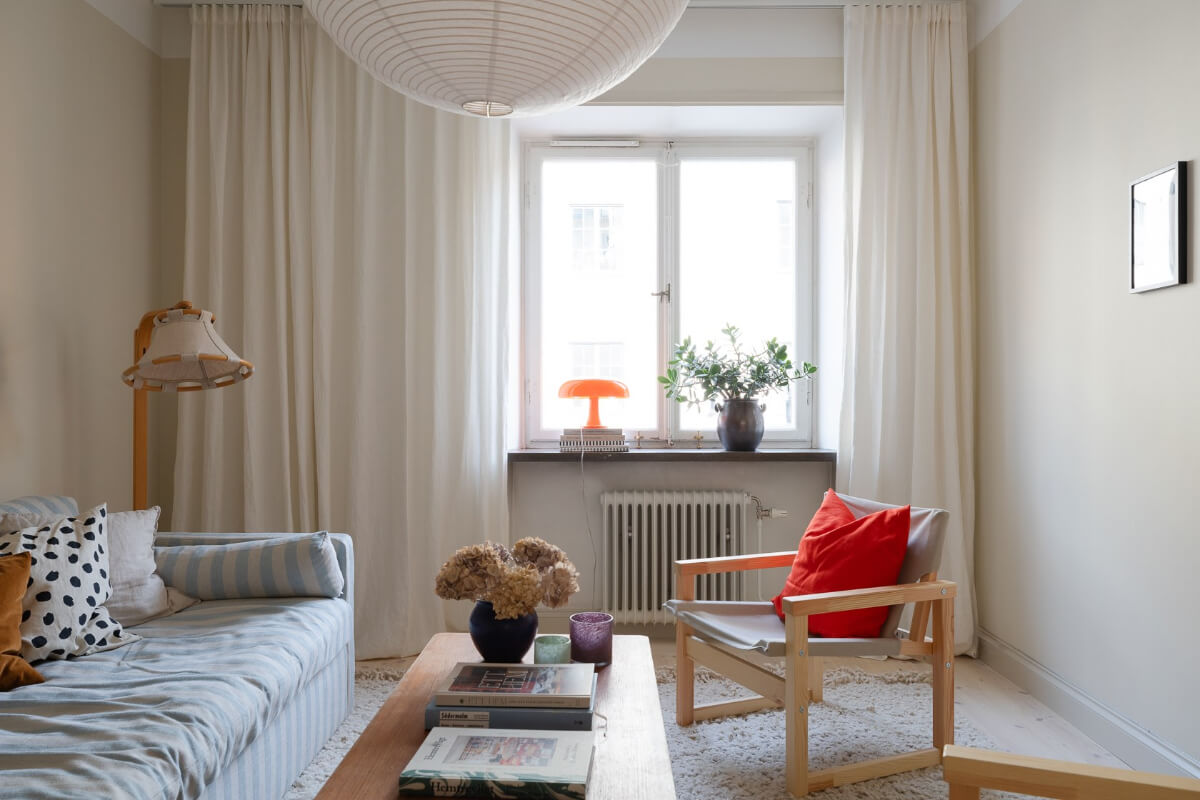 Modern Interiors in a Bright 1930s Apartment in Sweden 15 living room blue striped sofa