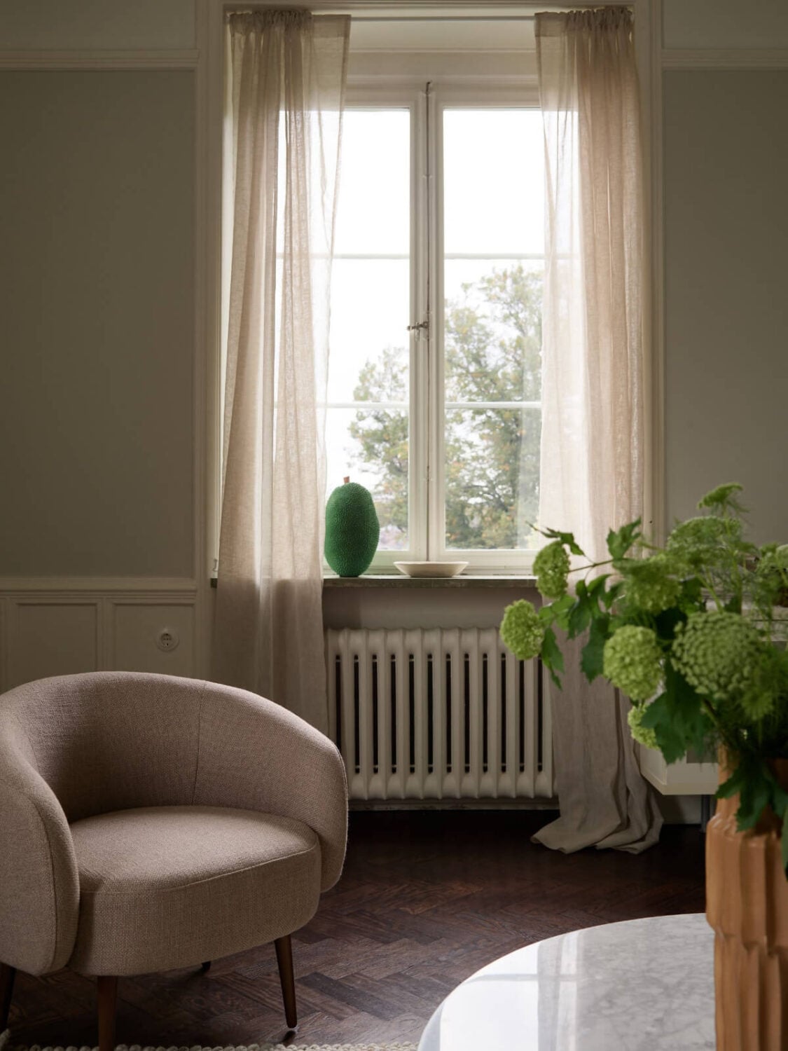 A Grand Early 20th-Century Apartment in Stockholm 11 living room detail accent chair