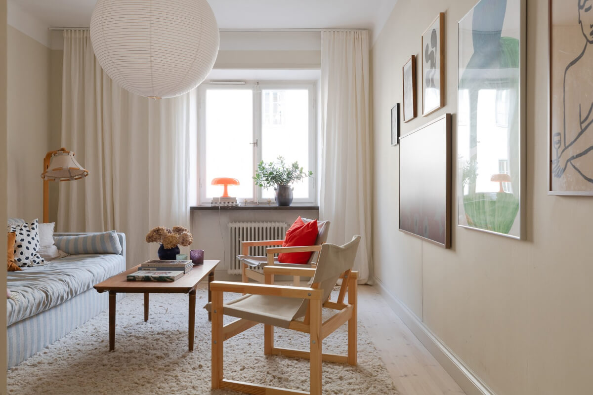 Modern Interiors in a Bright 1930s Apartment in Sweden 19 living room gallery wall