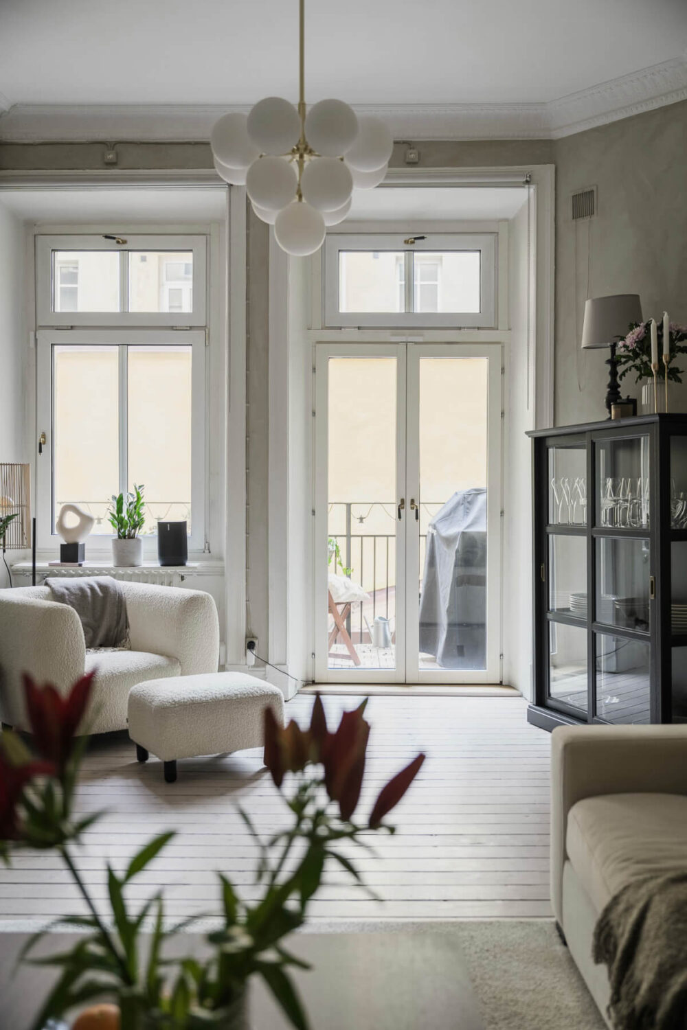 Limewash Wall and Period Features in a Swedish Apartment 4 living room glass doors to balcony