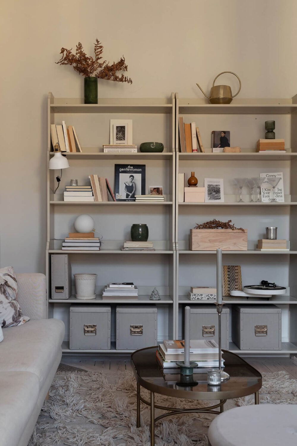 A Small Light Gray Apartment with Period Features 3 living room gray bookcases and walls